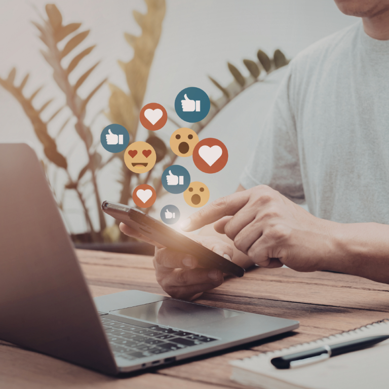Person using tablet and laptop for social media (1)